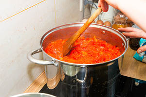 Cooking tomato sauce in big cooking pot, a Food & Drink Photo by Vapi