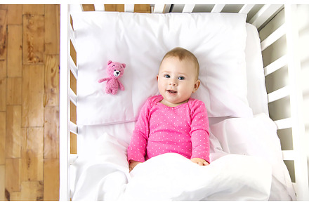 Baby toddler plays in the crib, a Person Photo by yanadjana