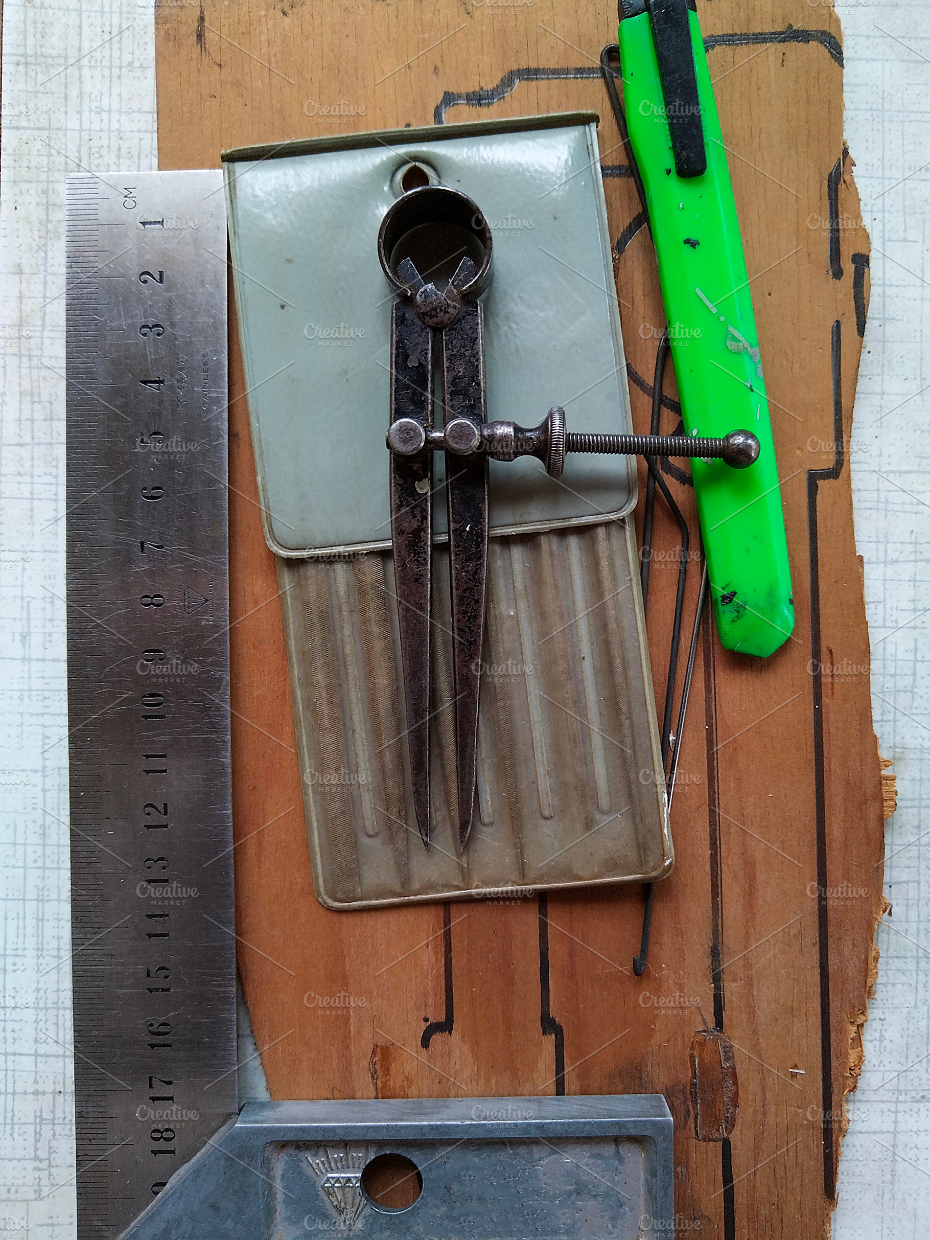 Collection of tools on a wooden surface with drawn outlines, a Sports & Recreation Photo by DanFLCreativo