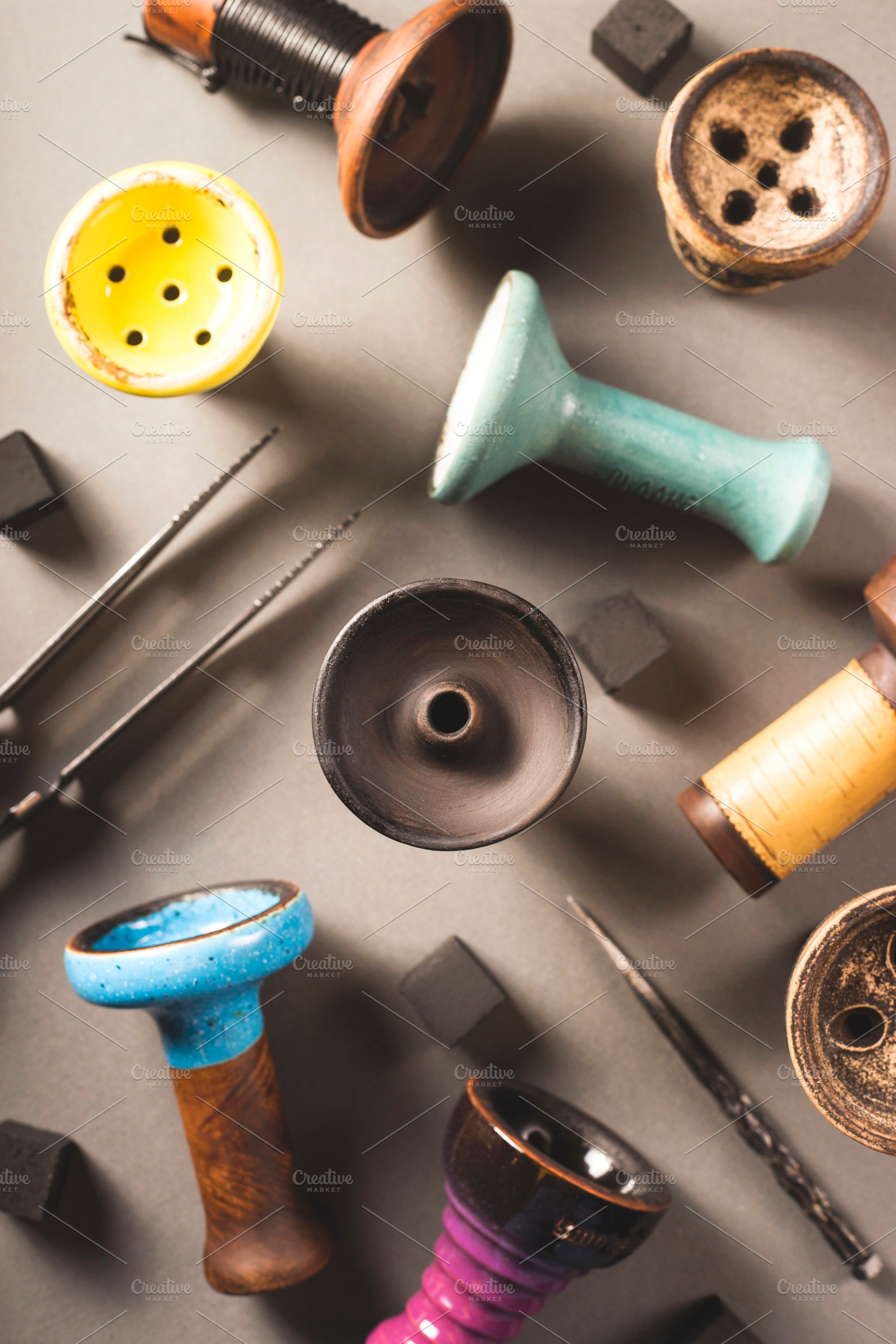 Many different ceramic color bowls containing hookah, tobacco, and shisha, an Abstract Photo by Valeriia • Svitlini