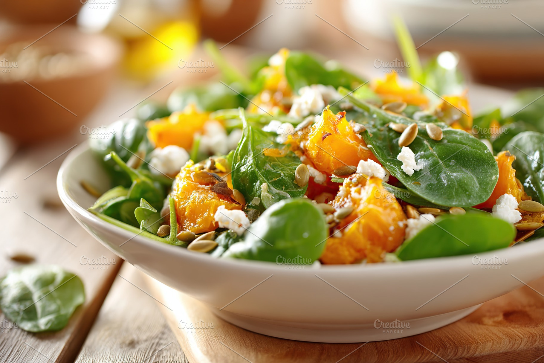 Fresh spinach and pumpkin salad with seeds and cheese served in a rustic bowl, a Food & Drink Photo by AlyaAnd