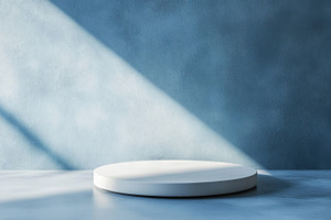 Circular platform on blue background, a Photo by Beautiful things