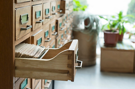 Drawers in archive featuring old, wooden, and archive