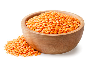 Red lentils in a wooden plate and a, a Food & Drink Photo by innakreativ