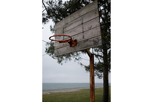 old basketball hoop without net in