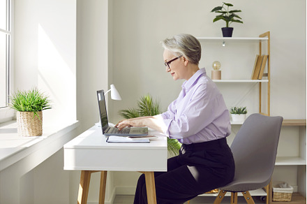 Mature businesswoman working on her, a Person Photo by StudioRomantic