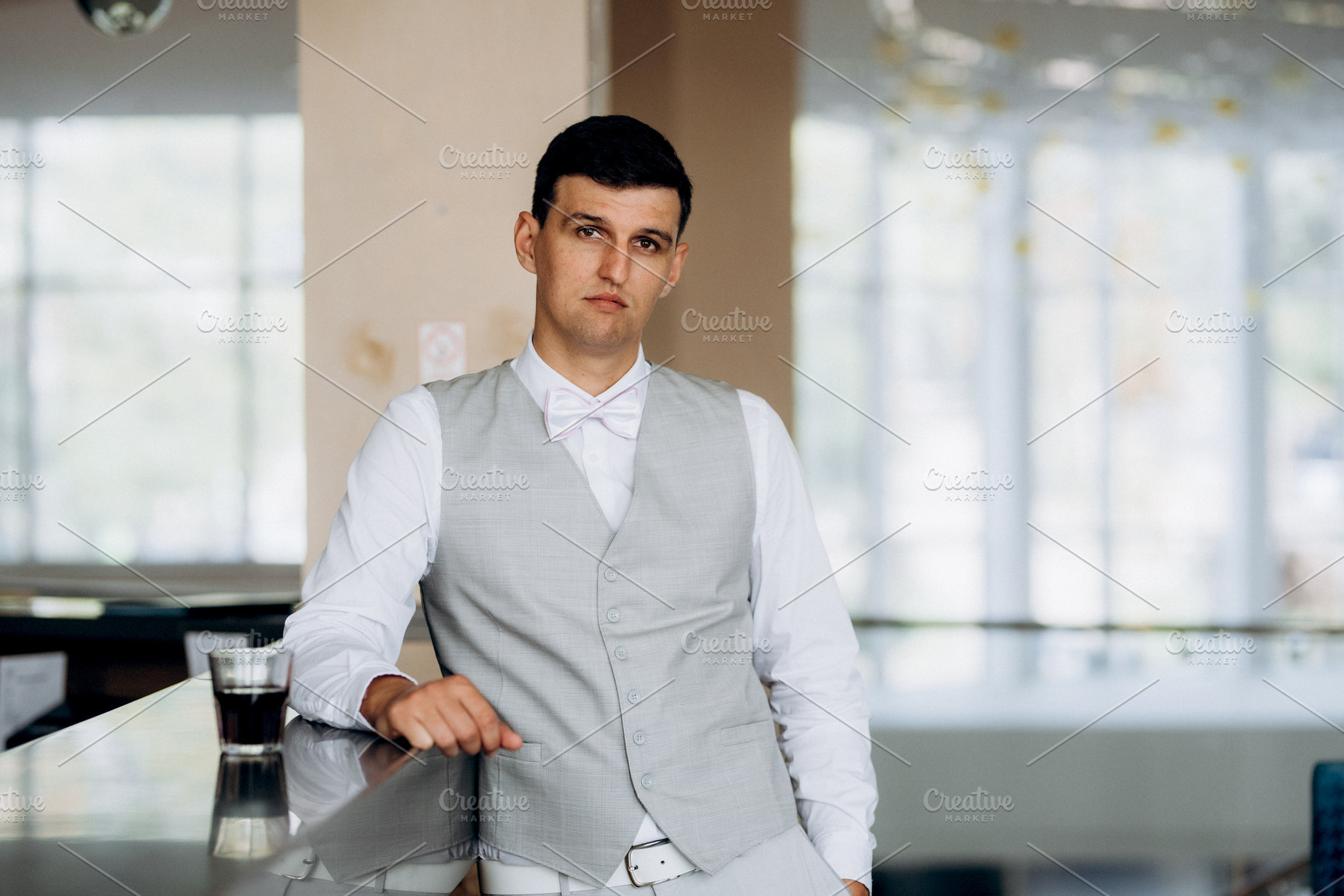 portrait of a groom in a suit and white bow, a Person Photo by Weddings, People, Travel