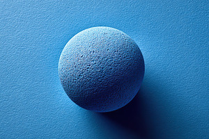 Vibrant cobalt sphere presented on a smooth blue surface in a flat lay arrangem, a Photo by AlyaAnd
