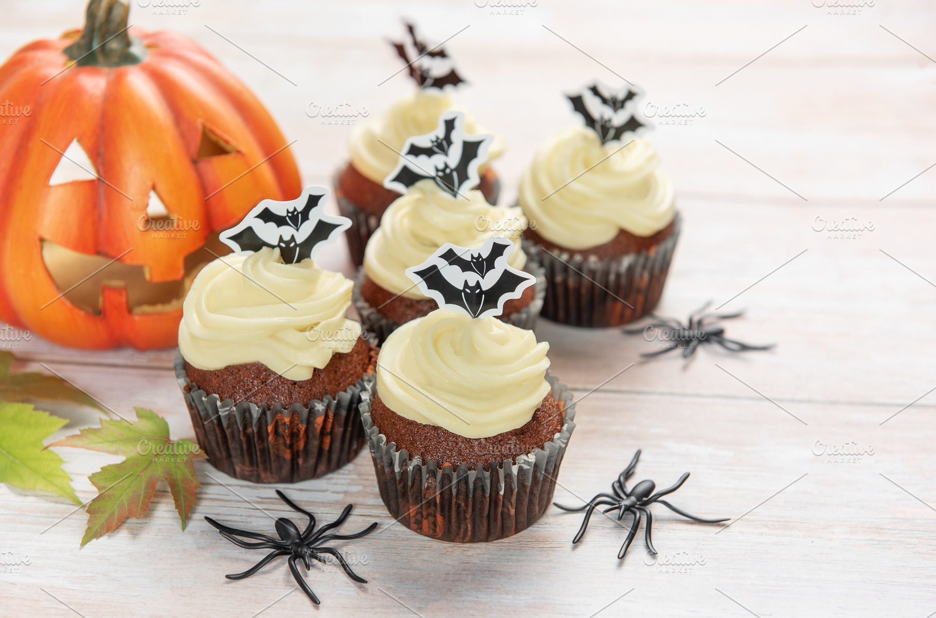 Halloween cupcakes decorating with bats, pumpkin, and spiders, a Food & Drink Photo by Olena Rudo