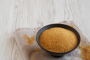 Organic Demerara Sugar in a Bowl, side view. Copy space., a Food & Drink Photo by LiudmylaChuhunova