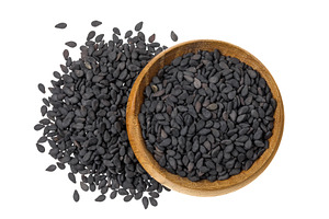 black sesame seeds in wooden bowl