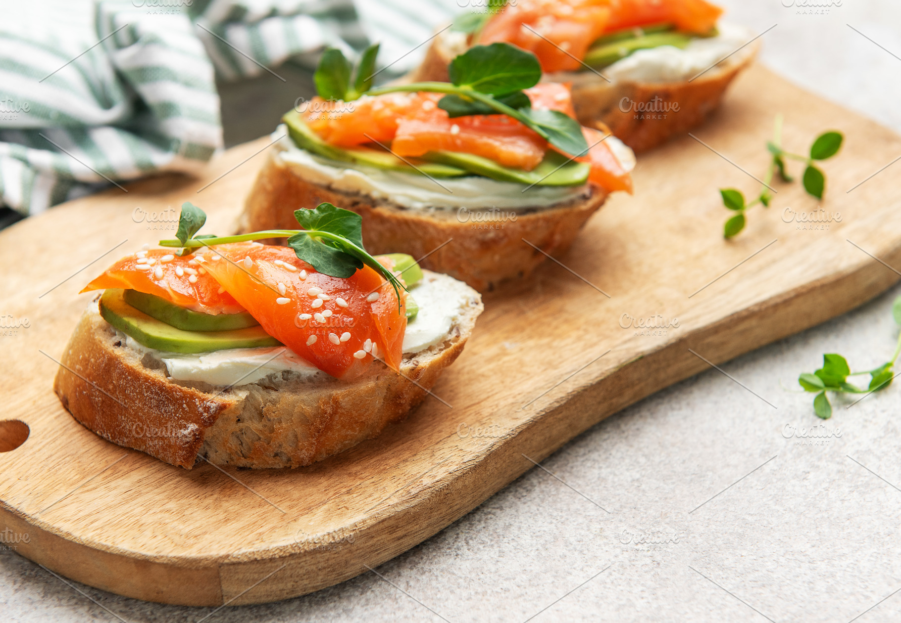 Smoked salmon toast with avocado and cream cheese, a Food & Drink Photo by Olena Rudo