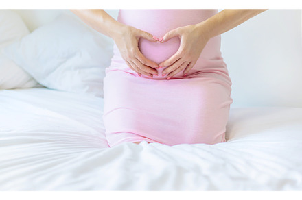 A pregnant woman in bed hugs her, a Person Photo by yanadjana