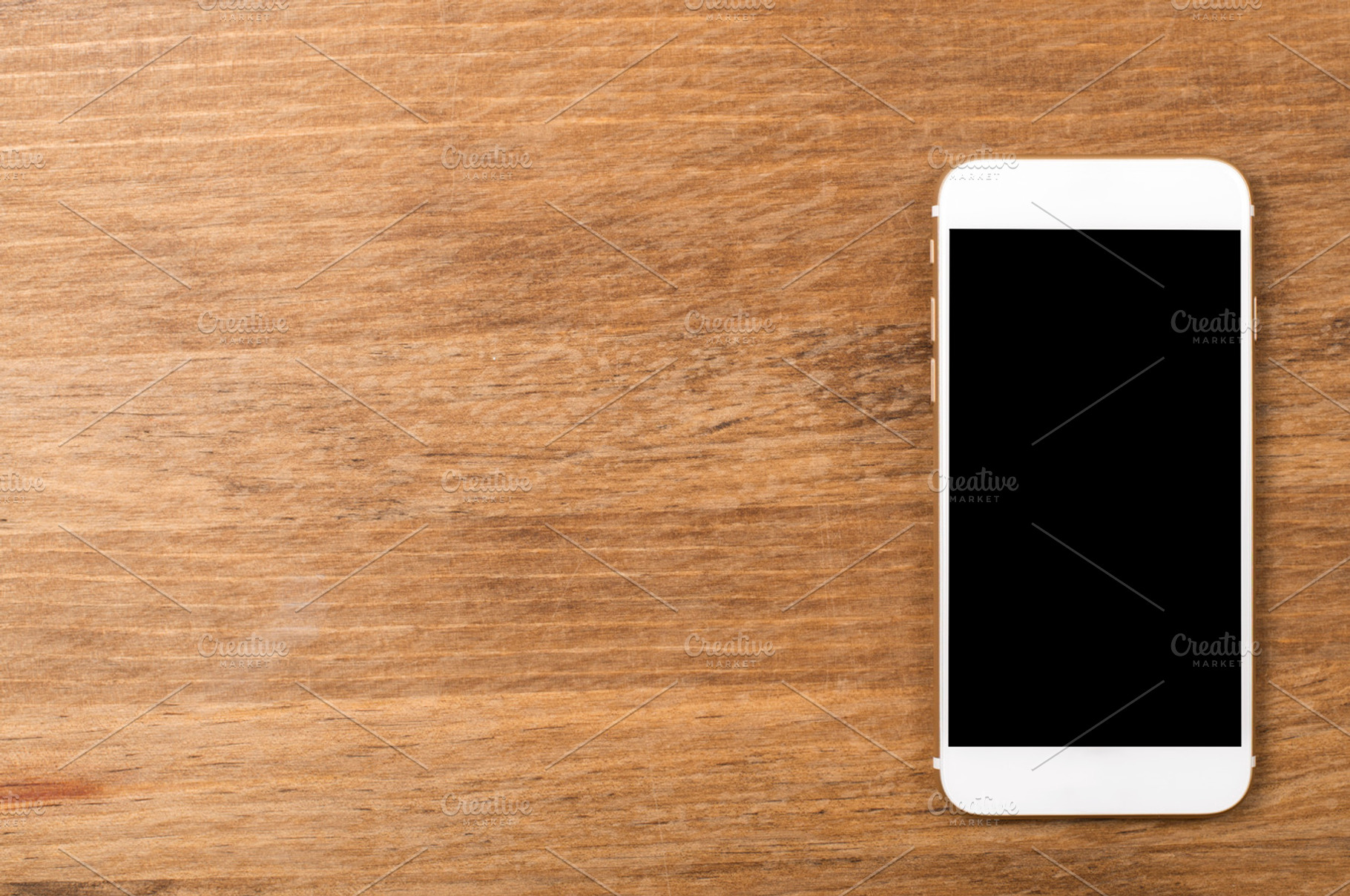 Smartphone on wooden table. Copy space., a Technology Photo by José Luis Agudo