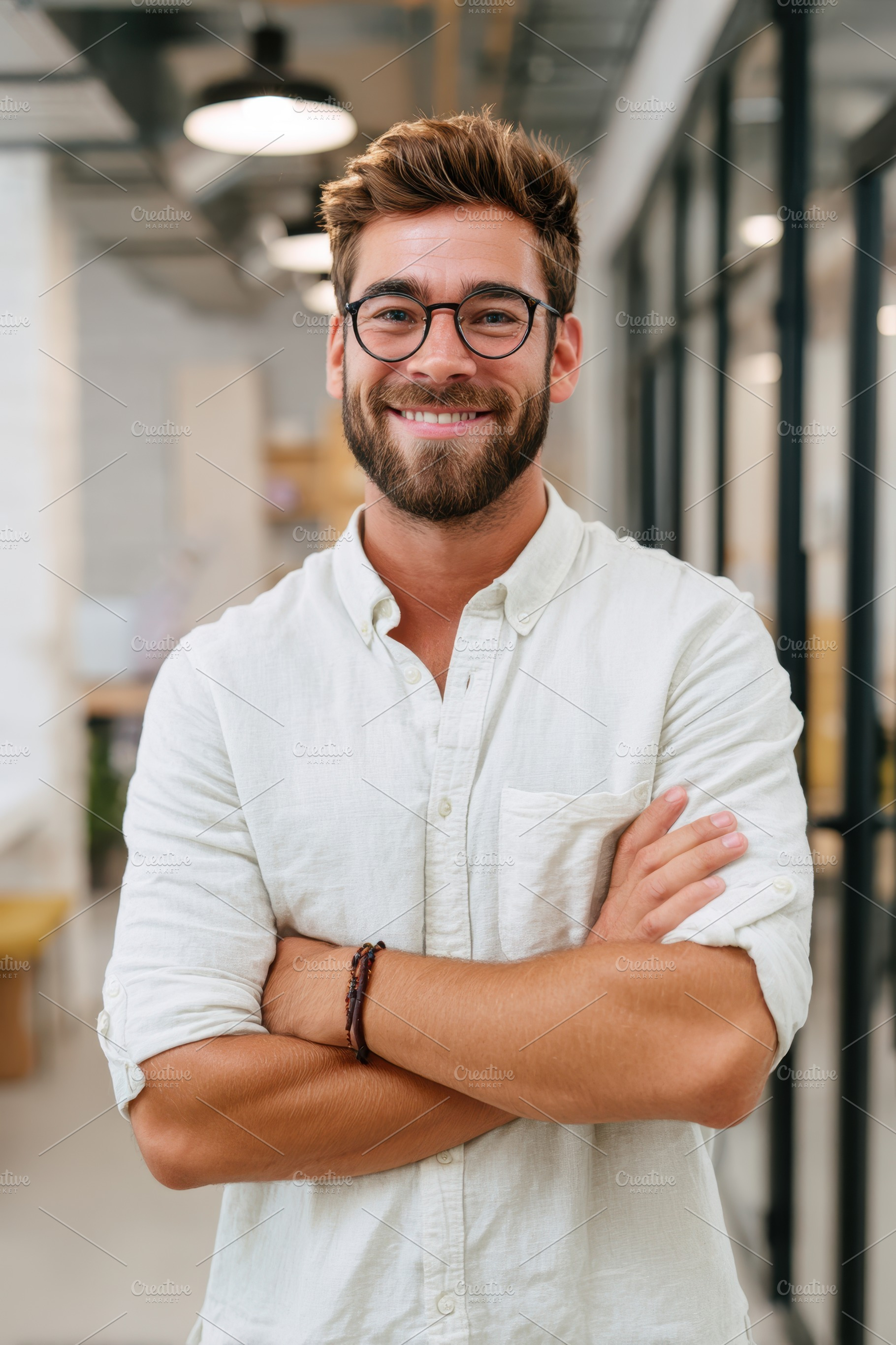Smiling young man in modern office setting, a Business Photo by AlyaAnd