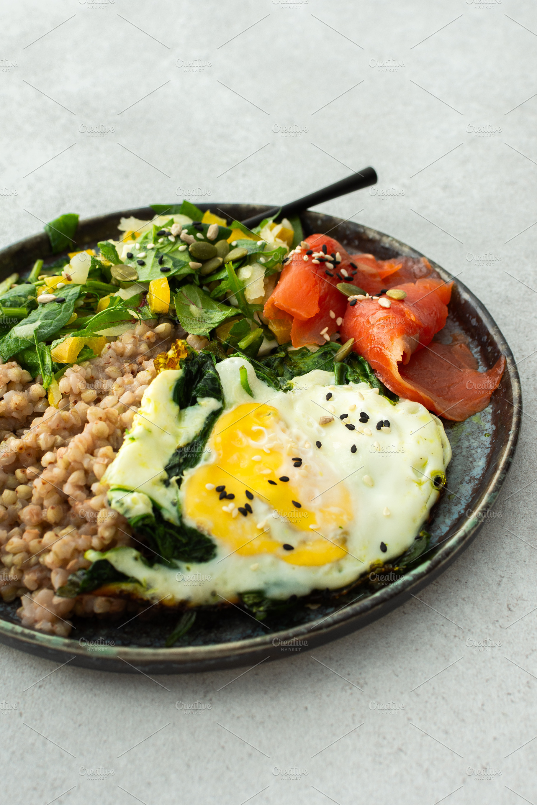 Buckwheat with fried egg and salmon, a Food & Drink Photo by Pundateam
