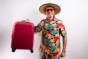 Tourist with suitcase and winning gesture, a Holiday Photo by karrastock