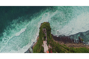 Turquoise waves crashing on rocky, a Nature Photo by Goinyk