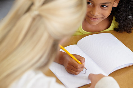 Helping her get to the answer, a Photo by Peopleimages.com