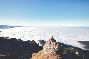 Hiker above clouds