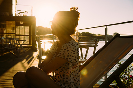 Woman enjoys sunset containing summer, sunset, and girl, a Person Photo by hitdelight