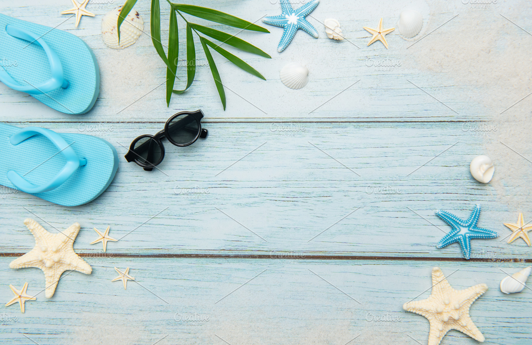Summer beach essentials on wooden background, a Holiday Photo by Olena Rudo