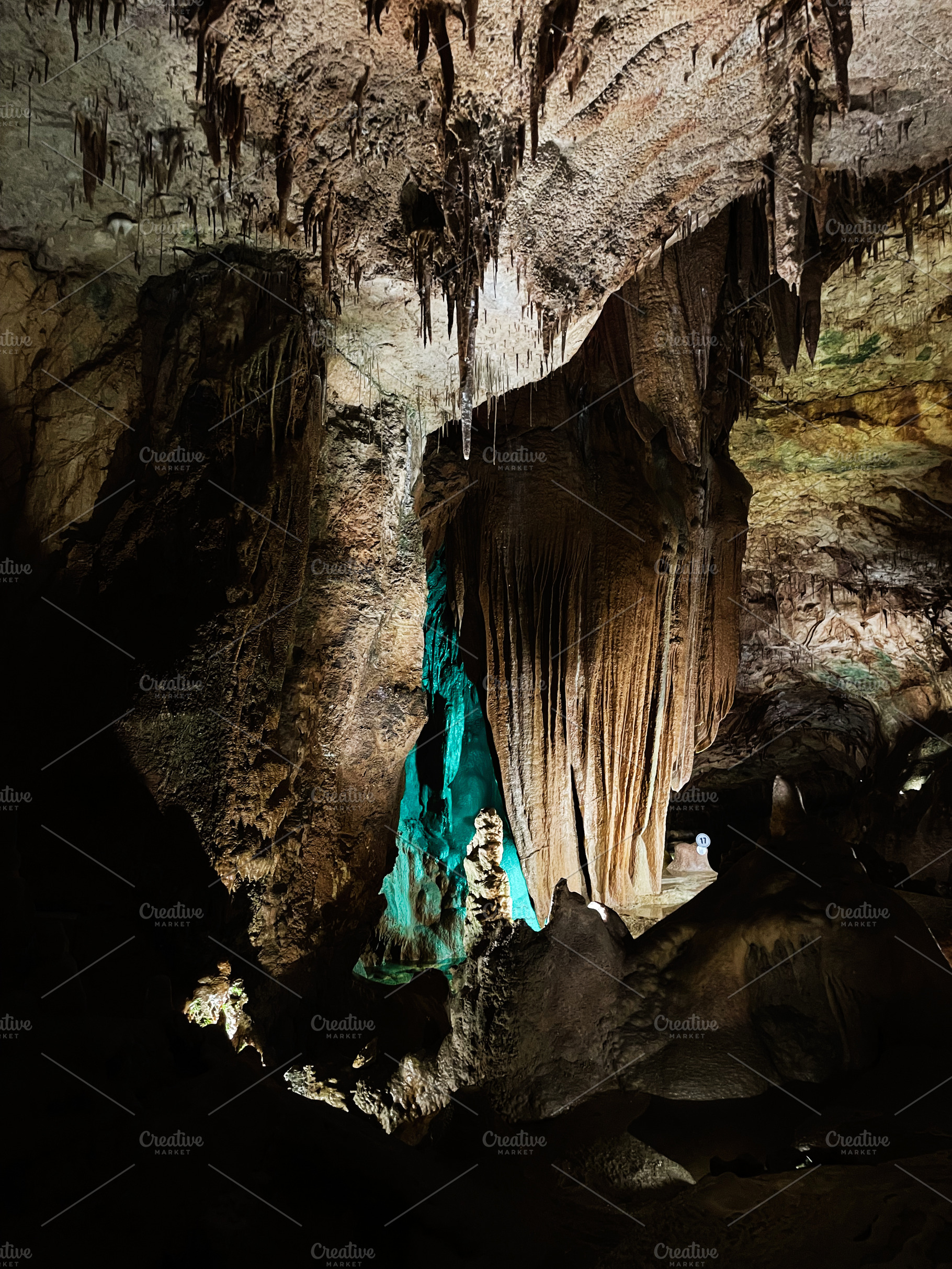 Majestic stalactites and stalagmites in Mira de Aire, Portugal., a Photo by AS photostudio