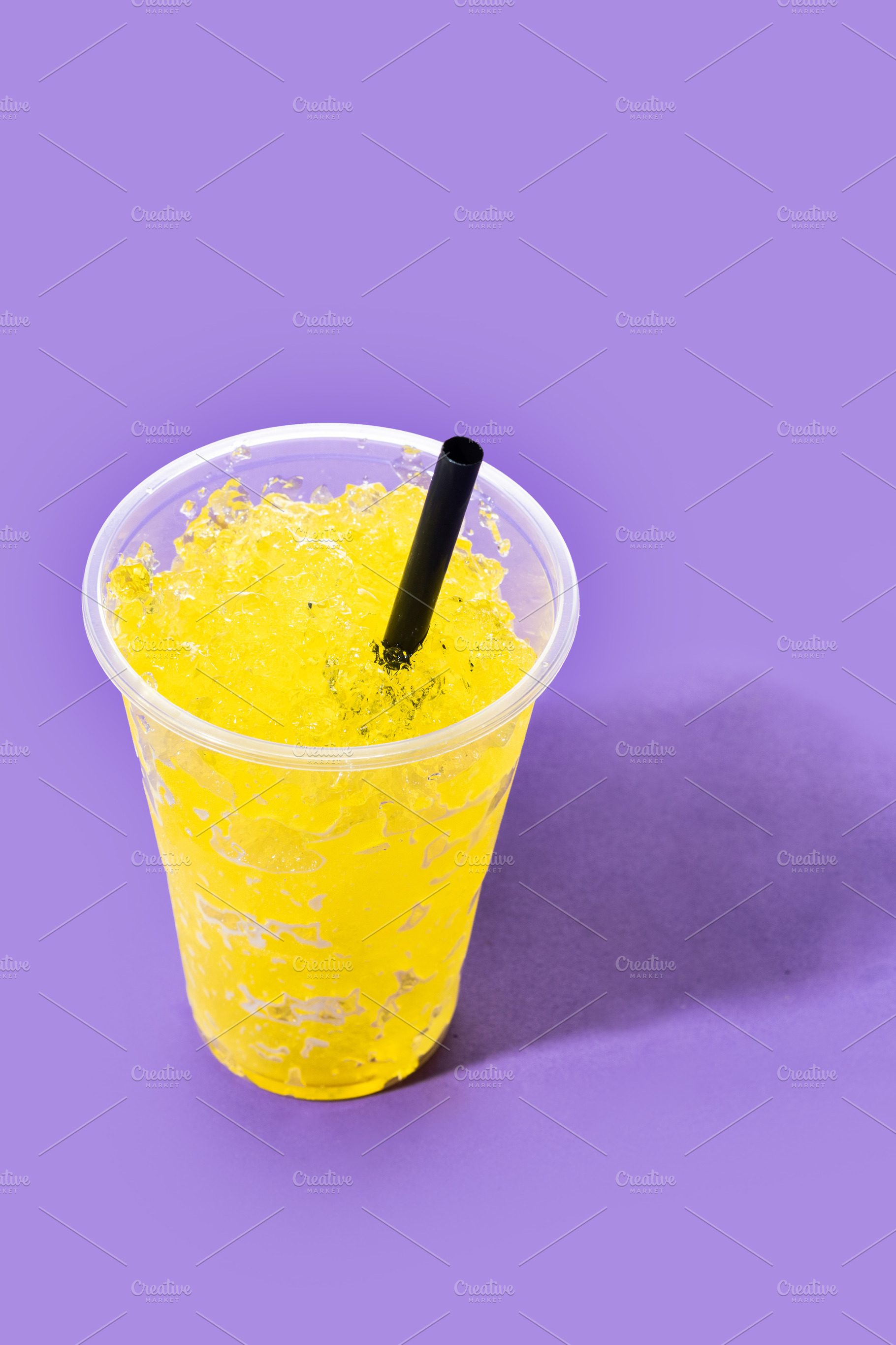 Yellow Slush Drink in Plastic Cup with Black Straw, a Food & Drink Photo by etorres69
