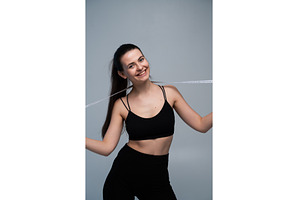 Young woman confidently holding a, a Sports & Recreation Photo by volodymyrshtun13795