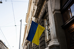 Ukrainian flag waving on a building in Lviv city on a clear day, a Photo by AS photostudio