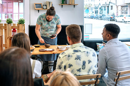 Young cook giving a cooking workshop, a Person Photo by davidpereiras