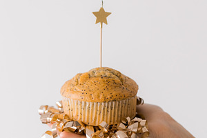 Birthday cupcake with a lit candle, a Food & Drink Photo by Kolomiyets Viktoriya