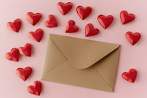 Valentines letter envelope with paper hearts, a Holiday Photo by AlyaAnd