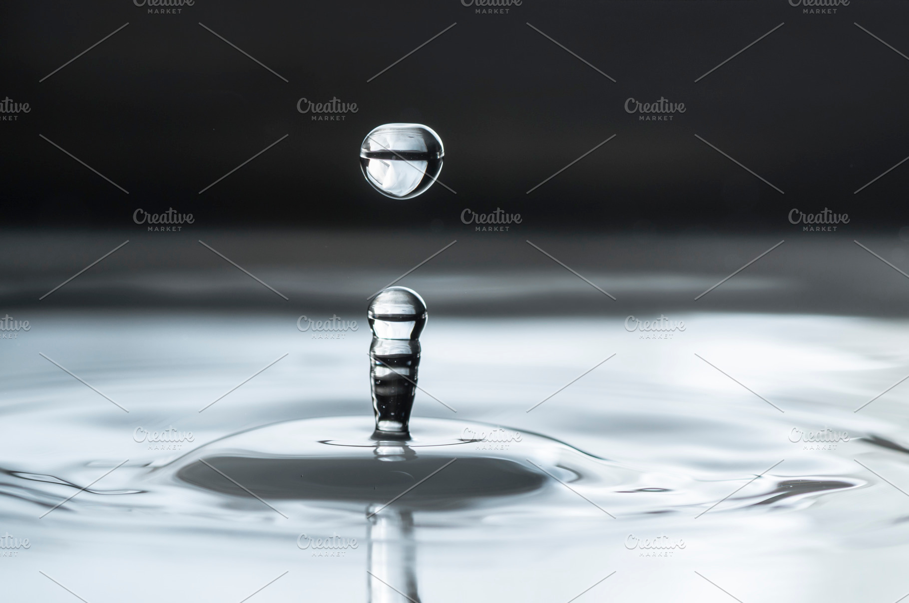 Water drops close up featuring water, drop, and splash, a Nature Photo by DegImages