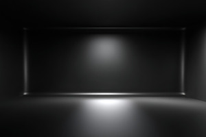 Dark empty room with soft spotlight illumination on black walls, an Abstract Photo by José Manuel Gelpi