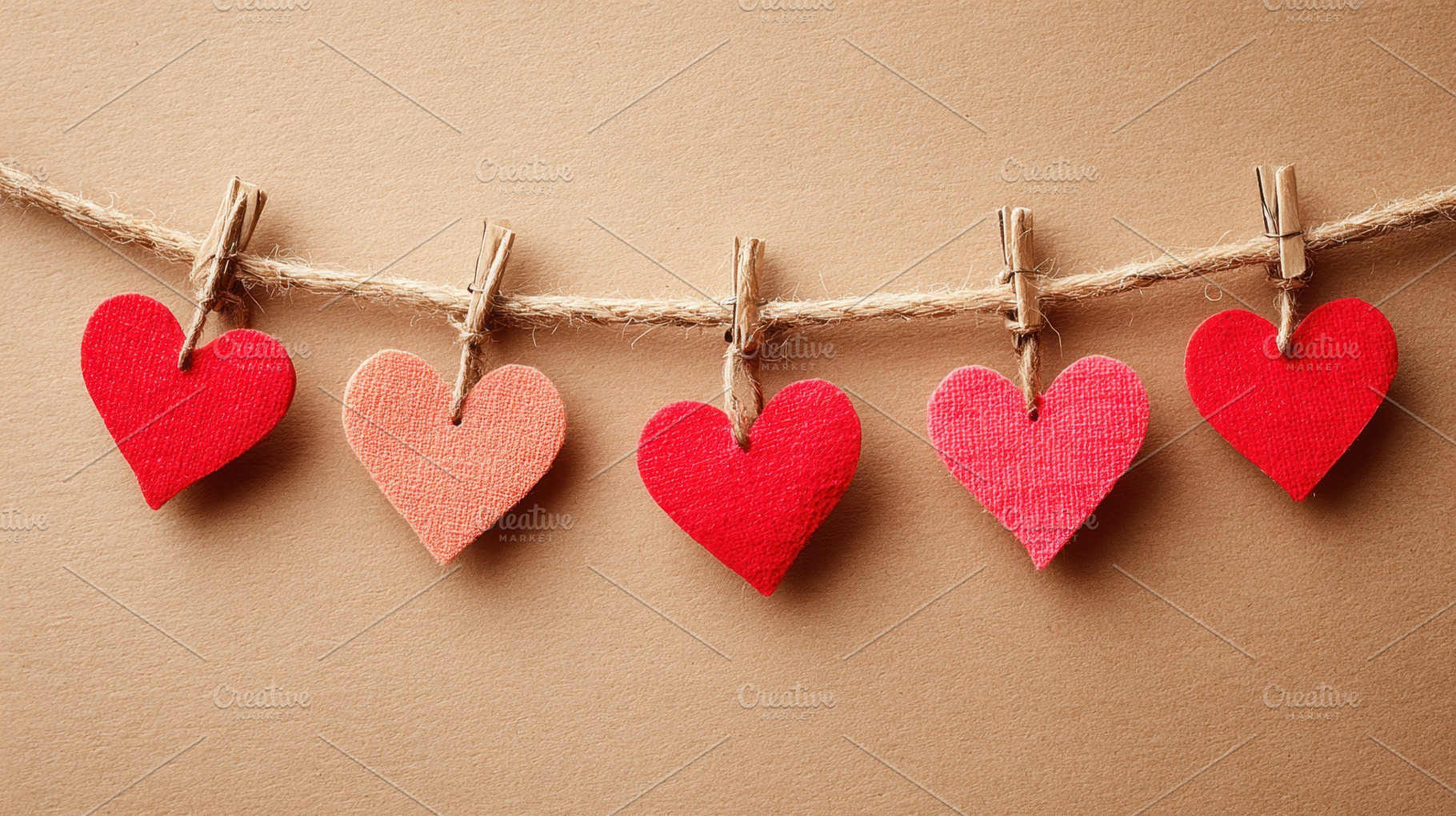 Colorful paper hearts hanging on twine, a Holiday Photo by AlyaAnd