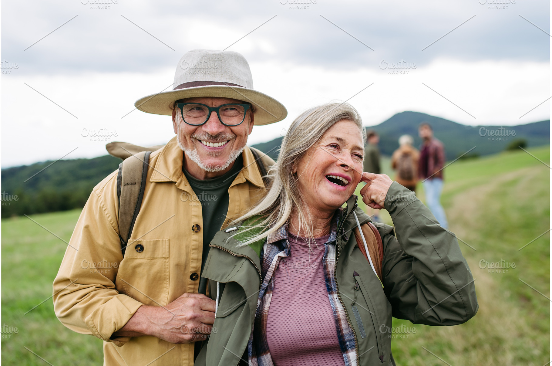 Older couple on group trip in autumn, a Holiday Photo by HalfPoint
