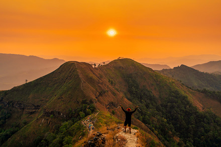traveler man hiking enjoying in the mountains with backpack at K, a Nature Photo by Casanowe-studio