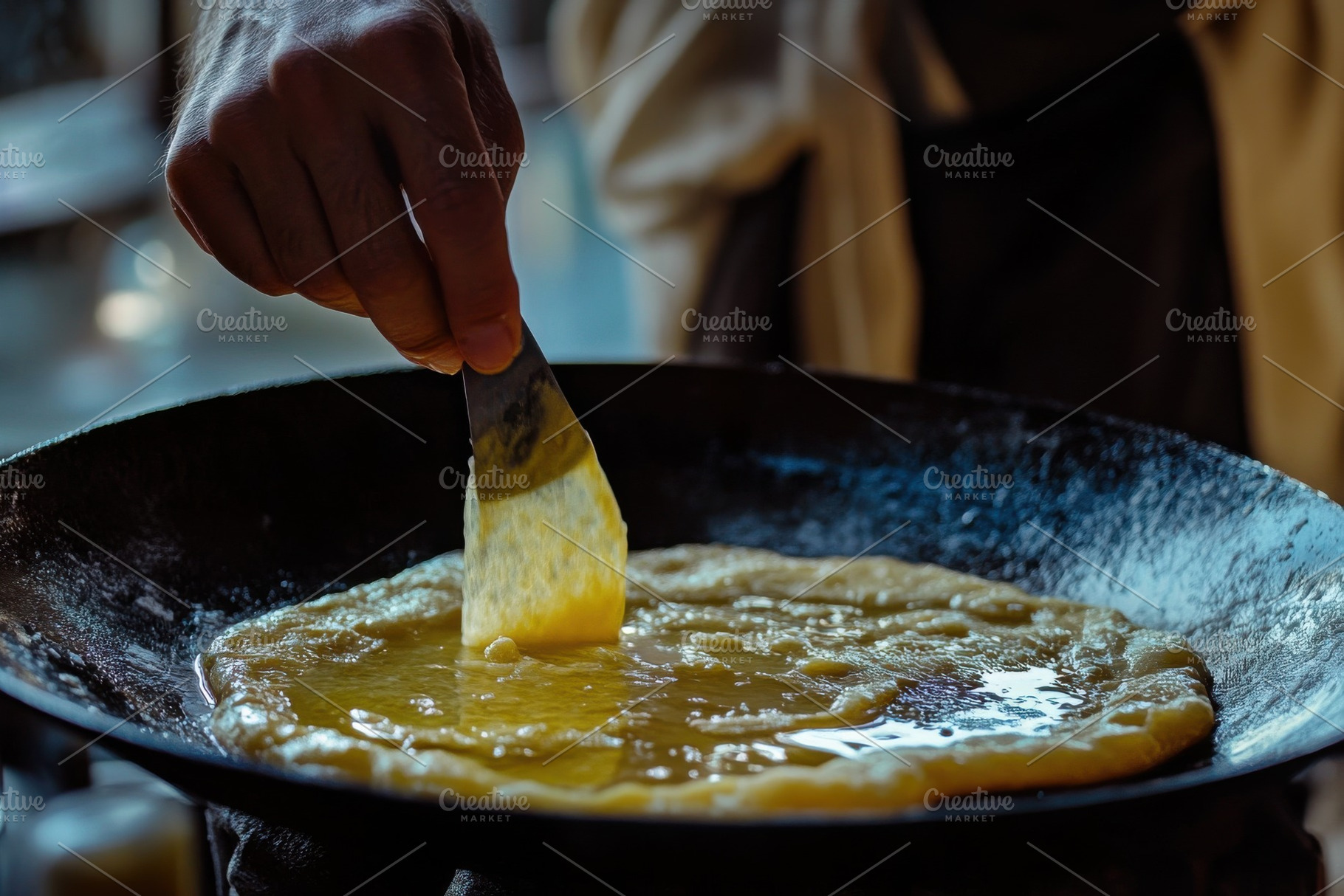 Creating delicious luqaimat in a tra, a Photo by Iftikhar Alam