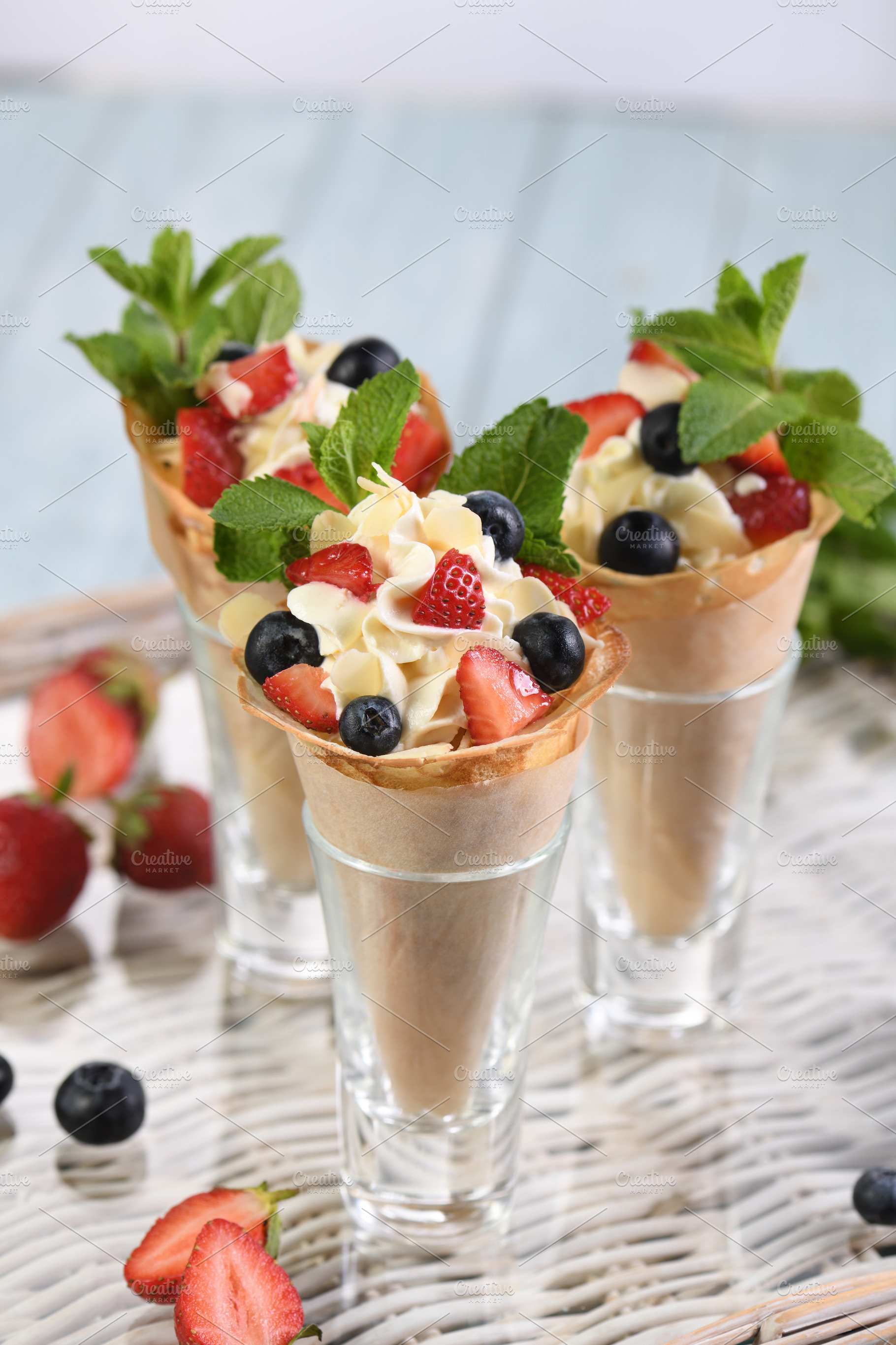Sweet crepe cones filled with whippe, a Food & Drink Photo by Apolonia