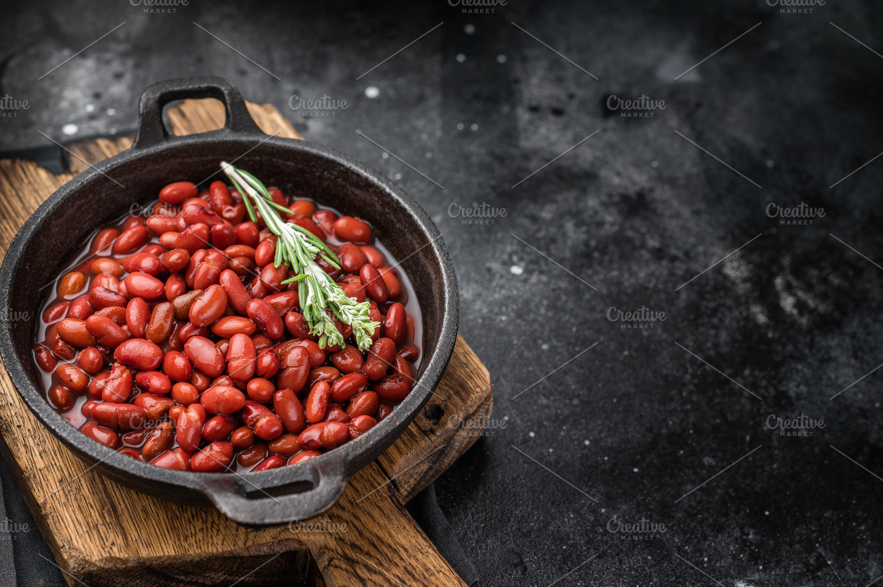 Top view of healthy vegan bean stew, garnished with fresh herbs., a Food & Drink Photo by composter-box@mail.ru