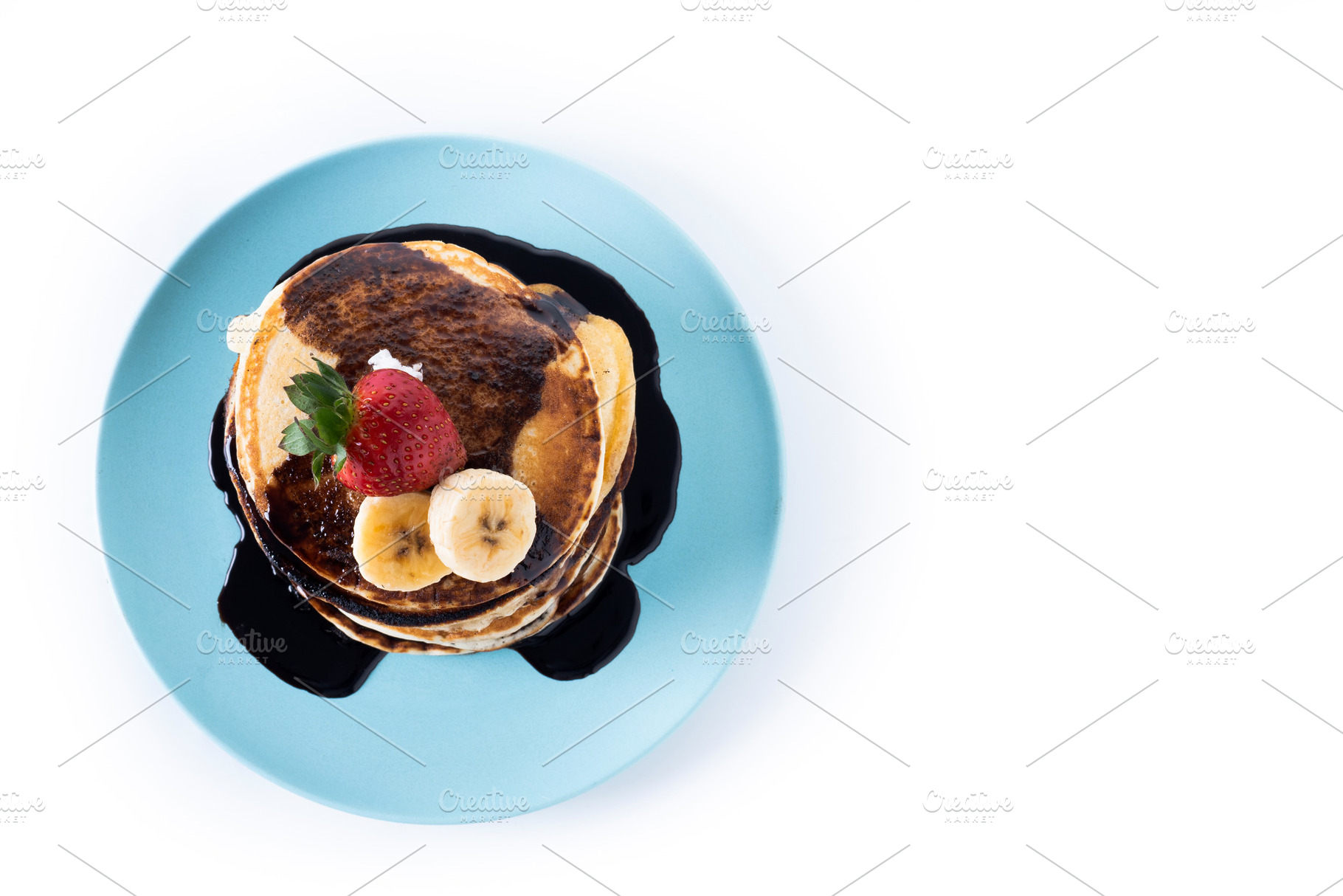 Pancakes with chocolate and fruit isolated on white background, a Food & Drink Photo by etorres69