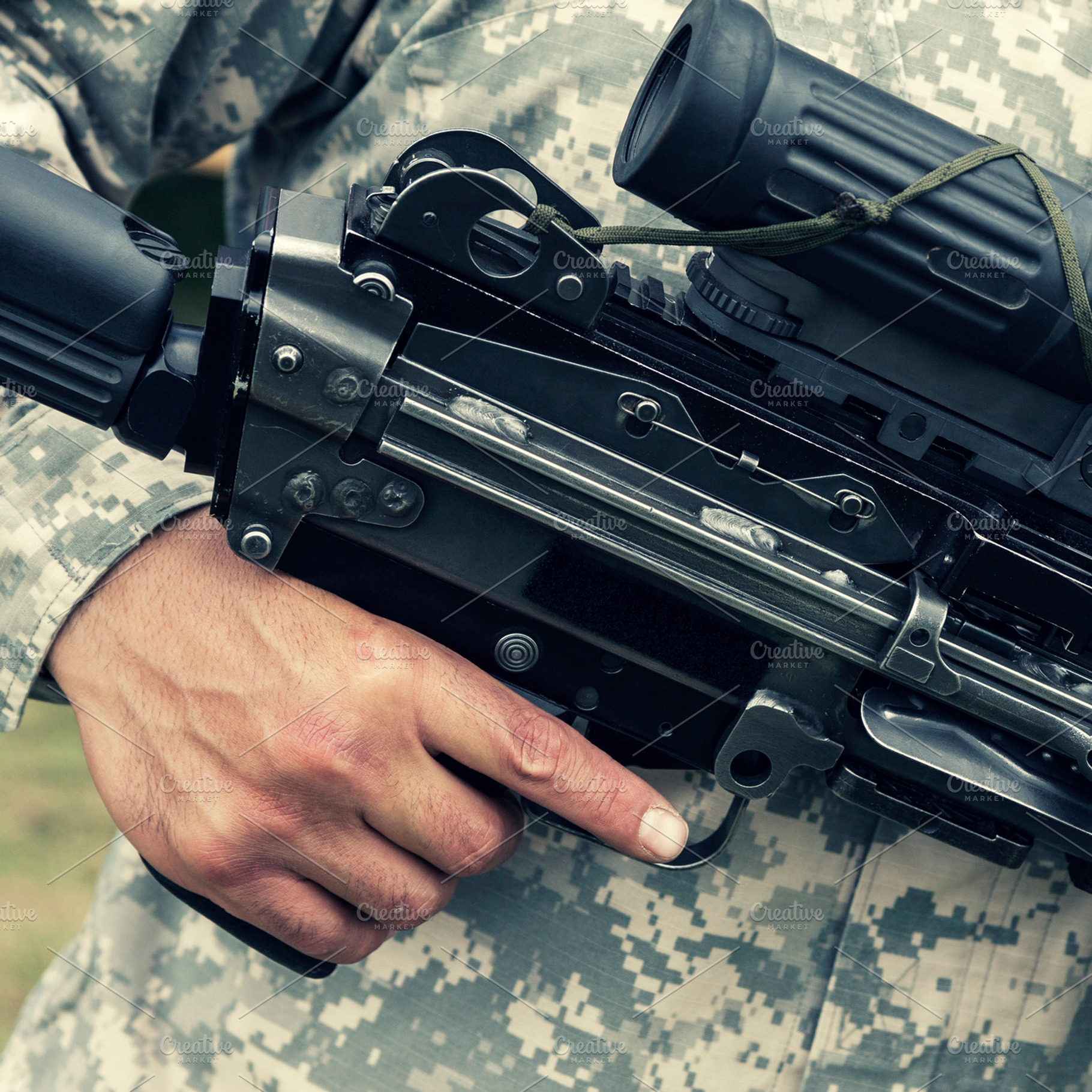 Soldier holding automatic gun, a Person Photo by BOOCYS