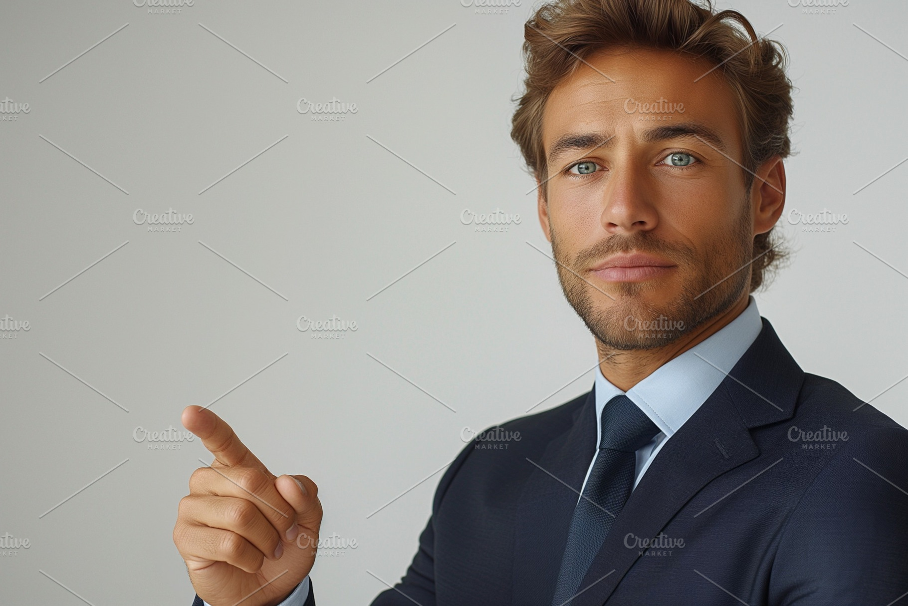 Confident young Caucasian man in a suit pointing to the side, showcasing profes, a Person Photo by ImageMir