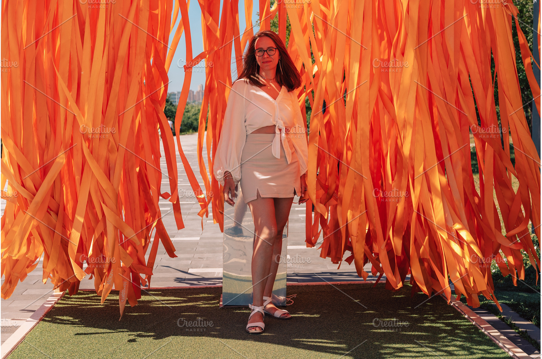 Woman Posing Among Bright Orange, a Person Photo by Jan Jack Russo Media