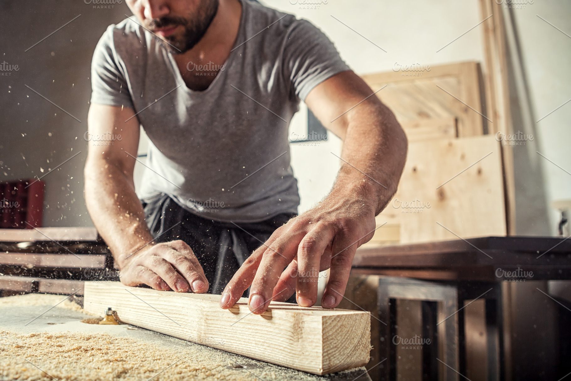 Carpenter working  at wooden bar, an Industrial Photo by Sova