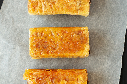 Homemade Baklavas with Honey, Chocolate and Almond on a black ba, a Food & Drink Photo by LiudmylaChuhunova