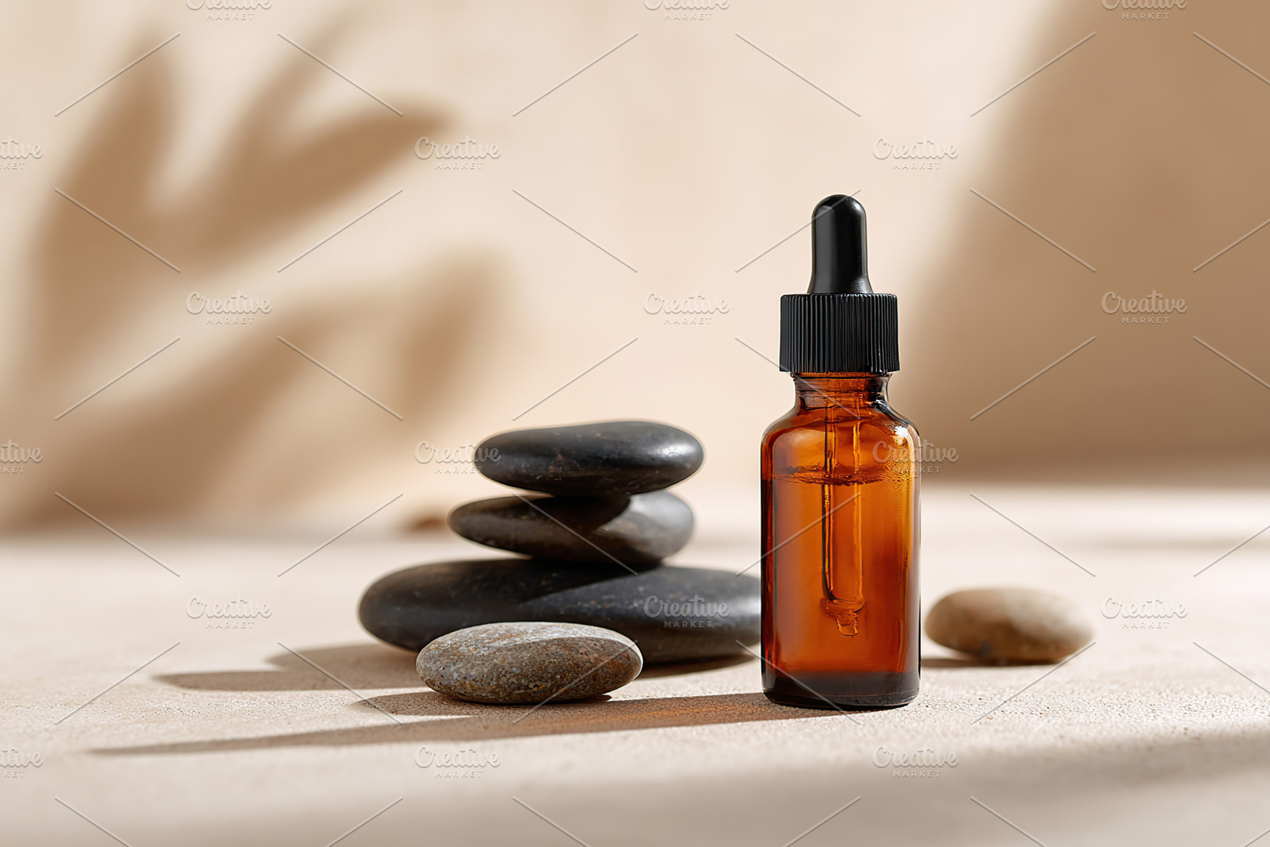 Essential oil dropper bottle with stones on soft surface for relaxation and wel, a Photo by AlyaAnd