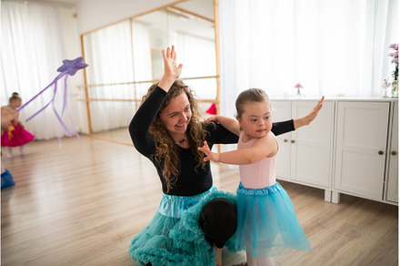 Little girl with down syndrome, a School & Education Photo by HalfPoint