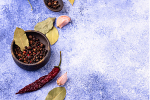 Culinary background with pepper, bay, a Food & Drink Photo by Yulia Furman